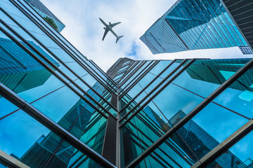 plane flying over the skyscrapers