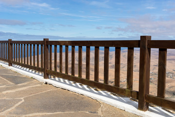 View through the fence on the mountains of Fuerteventura. Canary Islands. Spain