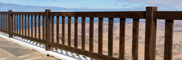 View through the fence on the mountains of Fuerteventura. Canary Islands. Spain