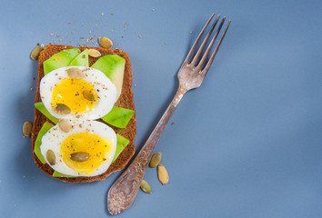 Toast with avocado and egg. Healthy diet.