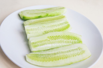 Peeled cucumber halves. Candid.