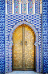 Entrance door with mosaic and brass door at the Royal palace in Fes Morocco