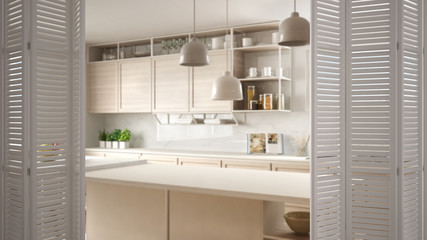 White folding door opening on modern white kitchen with wooden details and parquet floor, white interior design, architect designer concept, blur background