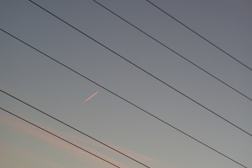 Power line mast, electrical network distribution background in the sky.