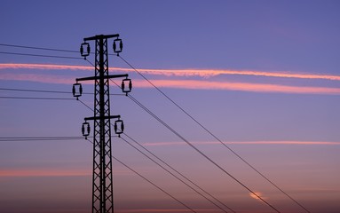 Power line mast, electrical network distribution background in the sky.