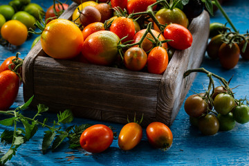 Harvest of fresh tomatoes in crate