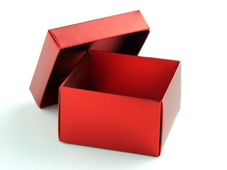 Empty red gift box with the lid open on a pure white background.