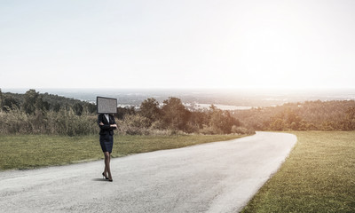 Obraz premium Business woman with TV instead of head.