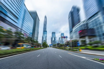 Naklejka premium city road through modern buildings in shenzhen