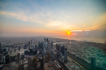Fototapeta premium The top view on Dubai from the highest tower in the world, Burj Khalifa, UAE
