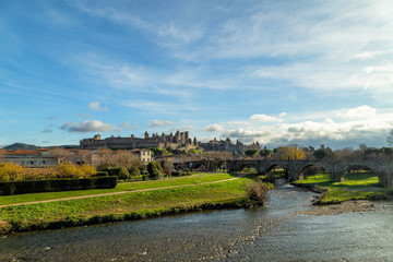 Fototapeta na wymiar Cite de Carcassonne, medieval castle in Carcassonne, France and the Pont Vieux crossing the Aude river