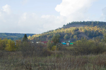a small village surrounded by mountains and forests
