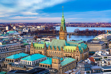 The Hamburg City Hall (German: Rathaus) with downtown and the lake Alster in the afternoon. Aerial...