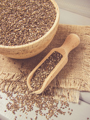Chia seeds on wooden background. A component of a healthy diet.