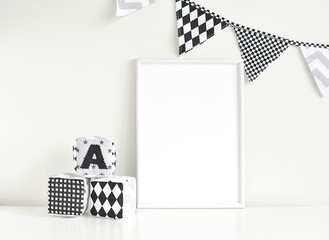 Empty white frame mockup for artwork, painting, posters or photo, monochrome nusery interior with...