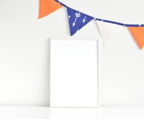 White wooden frame mockup for nursery, frame for photo, artwork, poster, print presentation, flag garland with arrows.