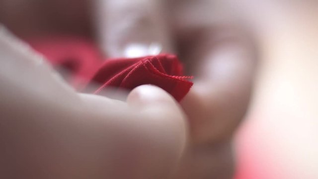 hands close-up macro sewing clothes needle