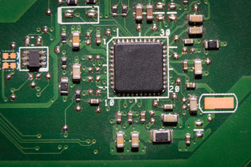 green computer board with chips and pins
