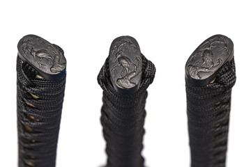 3 views of crane Kashira : butt cap (or pommel) made of steel on the end of the black cord handle ...
