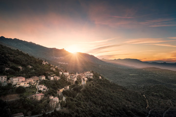 Sunset over mountain village of Belgodere in Corsica
