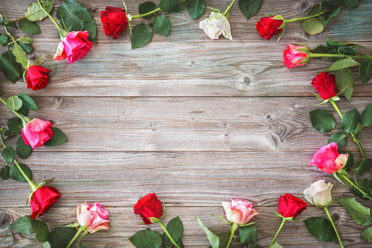 Roses on wooden board.