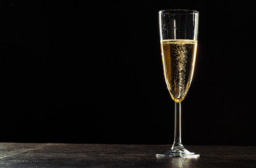 Champagne glasses for festive occasion against a dark background