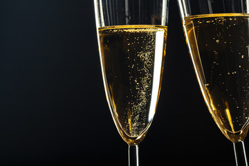 Champagne glasses for festive occasion against a dark background