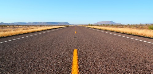 Endless open straight road in Big Bend National Park in Texas - Powered by Adobe