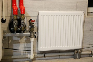 Heating of the house with a large number of steel pipes, pressure gauges and metal pipes, selective...