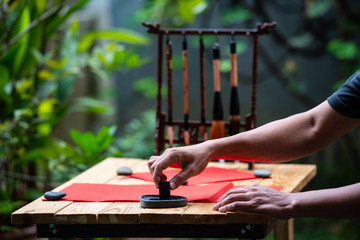 Preparing ink for Chinese calligraphy writing for Chinese New Year