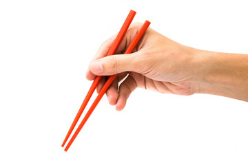 hand holding red chopsticks isolated on white