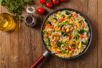 Nasi goreng. Fried rice with egg and vegetables.