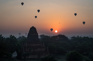 Hot air balloons fill the dawn sky in Bagan, Myanmar