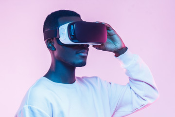 African american man in vr glasses, watching 360 degree video with virtual reality headset isolated...