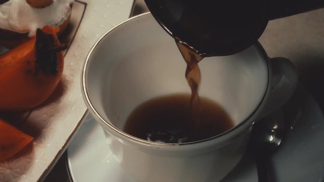 hot coffee pour into a Cup close-up 4 K