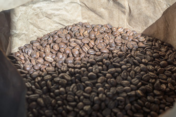 Coffee beans in a large paper bag