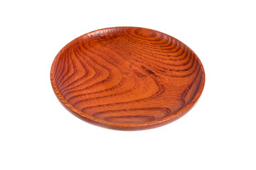 Wooden plate  and wooden spoon on white background