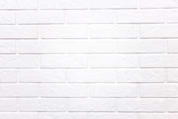 Obraz premium White wall of light brick, background with white brick.