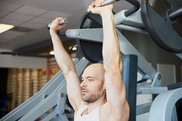 Training with dumbbell workout in the gym