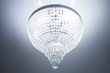 Crystal chandelier close-up and glowing crystals in the world