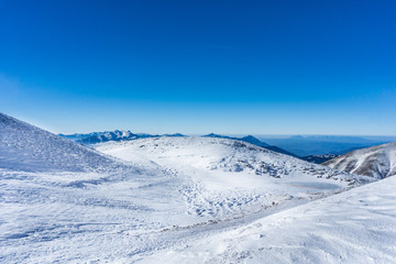 Winter landscape in a sunny day on the snow covered Velouchi mountain in Greece