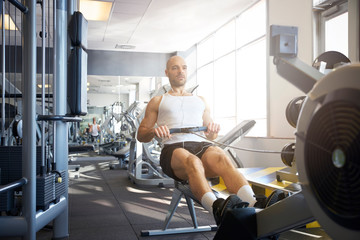 Middle aged man workout in the gym