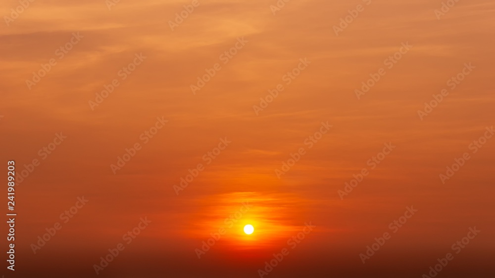 Wall mural the orange sky and cloud with the sun golden hour background