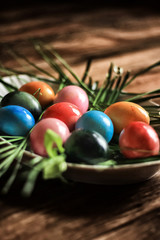 Easter eggs are painted in bright colors. Close-up shot. Daylight.