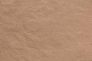 Fototapeta na wymiar Light brown, beige textured background, kraft paper background. Envelope crumpled paper. Horizontal image