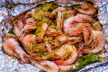 Fresh baked king shrimps with the oriental herbs