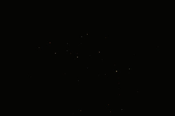 Bright colorful multicolored fireworks in the black sky
