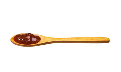 Barbecue sauce in small wooden spoon isolated on white background,
