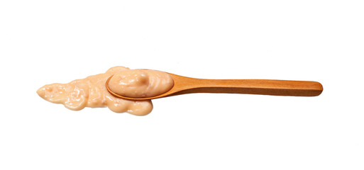 Shrimp sauce    in small wooden spoon isolated on white background,
