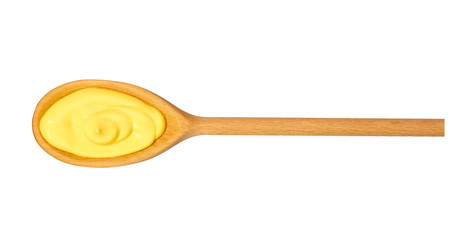 Cheese sauce in  wooden spoon isolated on white background,top view